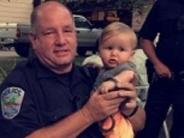 Police holding a baby
